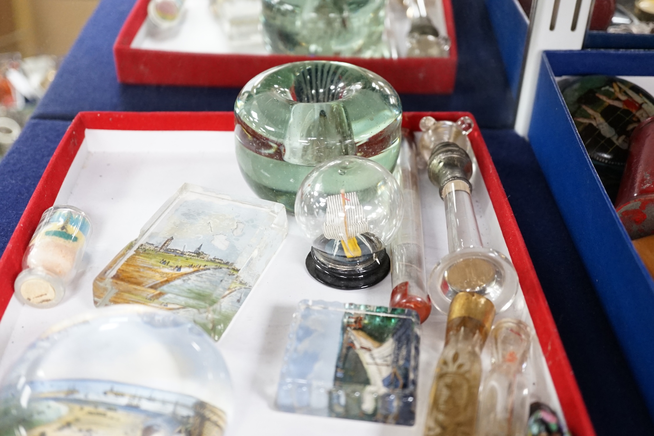A collection of mixed Victorian glass perfume bottles and files, souvenir paperweights, a glass letter opener and vase, etc. Condition - fair